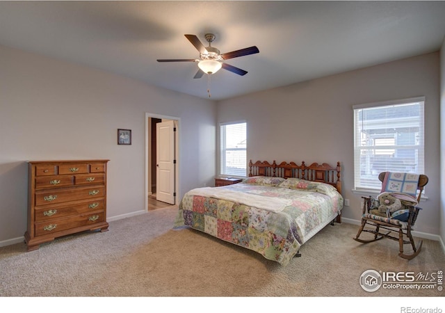 bedroom with ceiling fan and light carpet