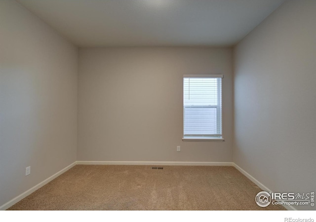 empty room featuring carpet flooring