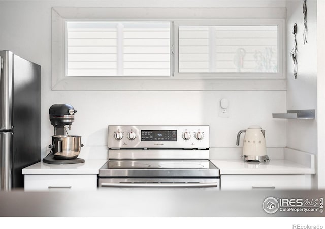 kitchen featuring white cabinetry and stainless steel appliances