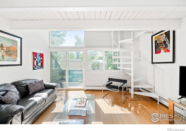 living room featuring light hardwood / wood-style flooring, beamed ceiling, and wood ceiling