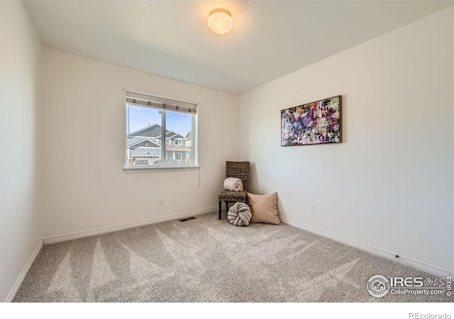 unfurnished room featuring carpet flooring