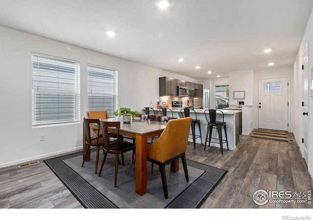3583 Booth Falls Dr, Loveland, CO 80538 - dining space featuring wood finished floors, recessed lighting, and baseboards