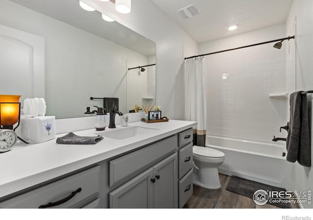 3583 Booth Falls Dr, Loveland, CO 80538 - full bathroom with hardwood / wood-style floors, vanity, shower / bath combination with curtain, and toilet