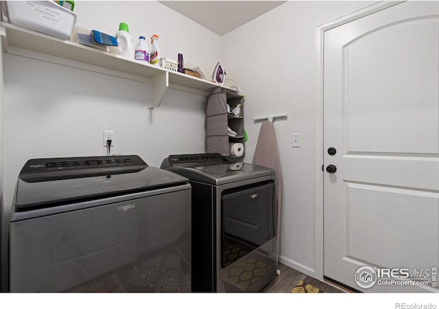 3583 Booth Falls Dr, Loveland, CO 80538 - laundry room with independent washer and dryer and wood finished floors