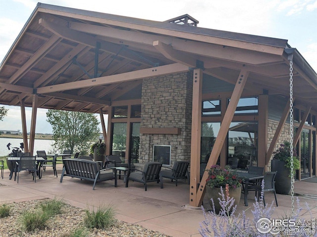 3583 Booth Falls Dr, Loveland, CO 80538 - view of patio / terrace with a gazebo, an outdoor living space, and a water view
