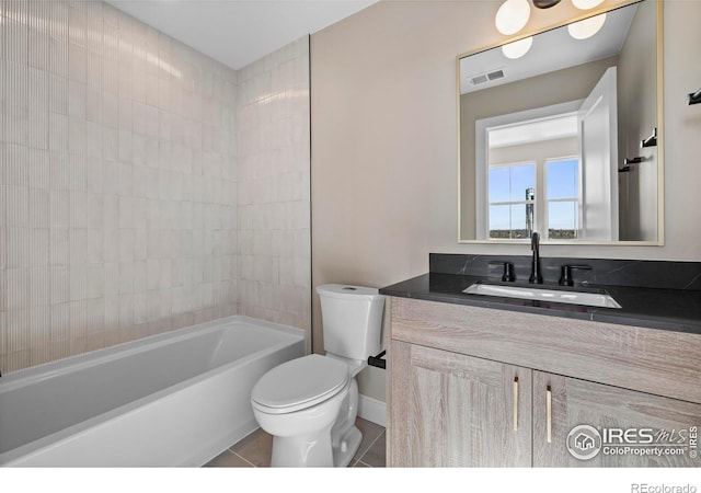 full bathroom featuring toilet, bathing tub / shower combination, tile patterned floors, and vanity