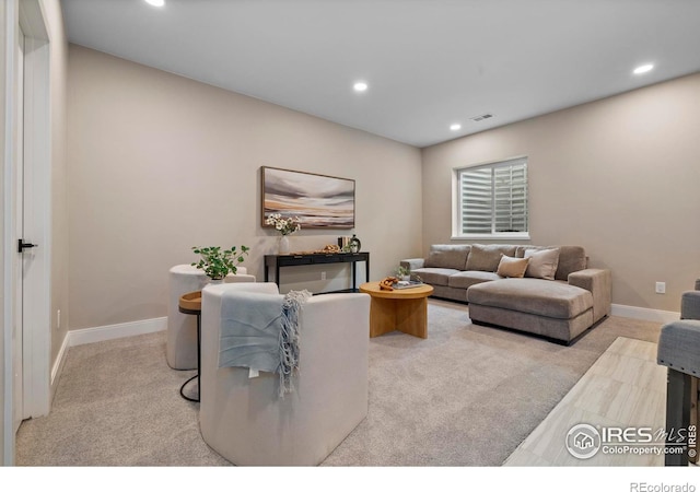 living room featuring light carpet