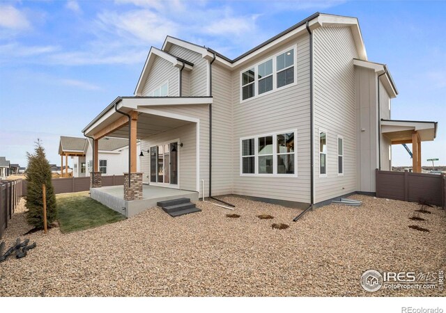 rear view of house featuring a patio