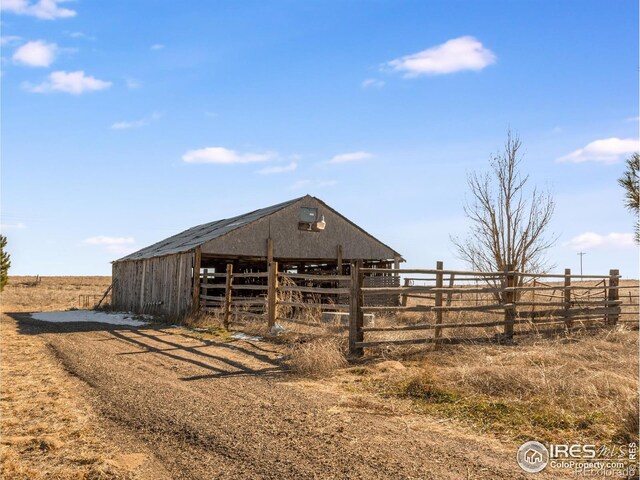 view of outbuilding featuring a rural view