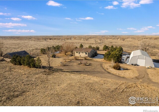 birds eye view of property featuring a rural view