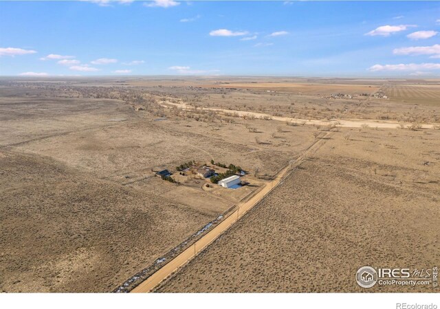 birds eye view of property featuring a rural view