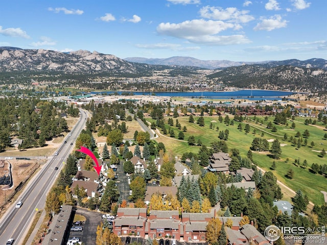 aerial view featuring a water and mountain view