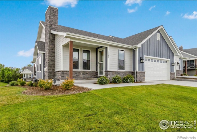 view of front of home featuring a garage and a front lawn