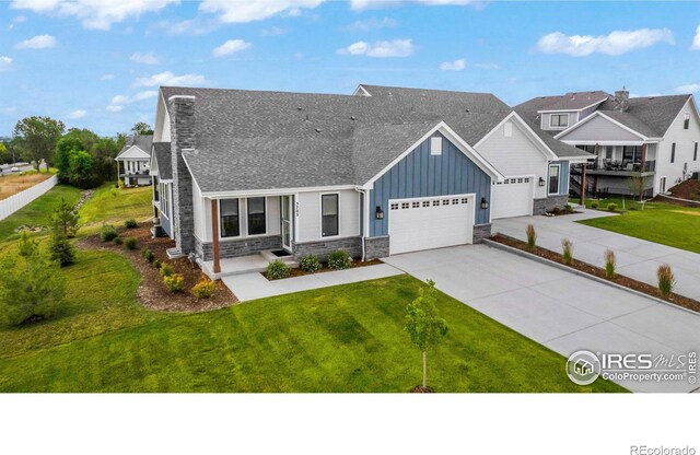 view of front of property with a garage and a front yard