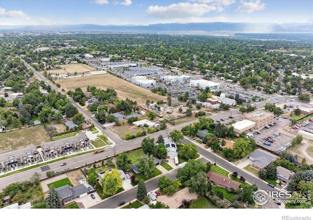 birds eye view of property with a mountain view