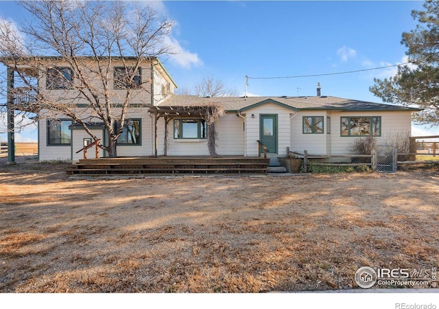 view of front of house with a deck and a pergola