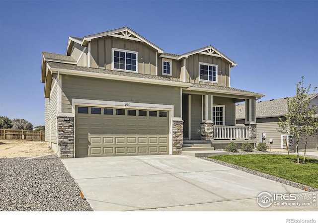 craftsman house featuring covered porch and a garage