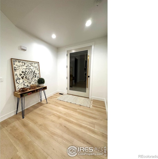 corridor featuring light hardwood / wood-style flooring