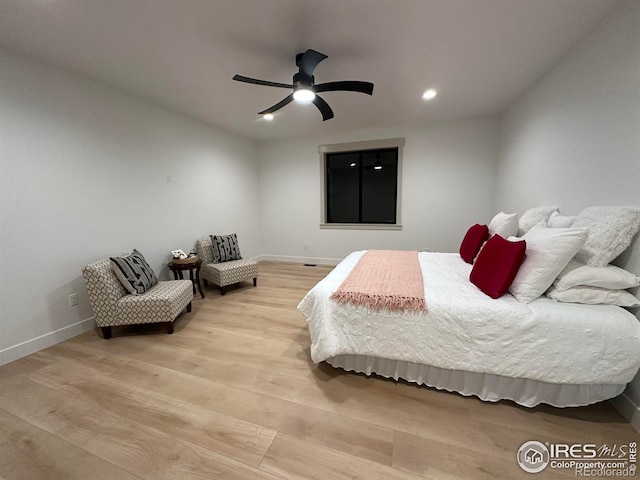 bedroom featuring light wood-type flooring and ceiling fan