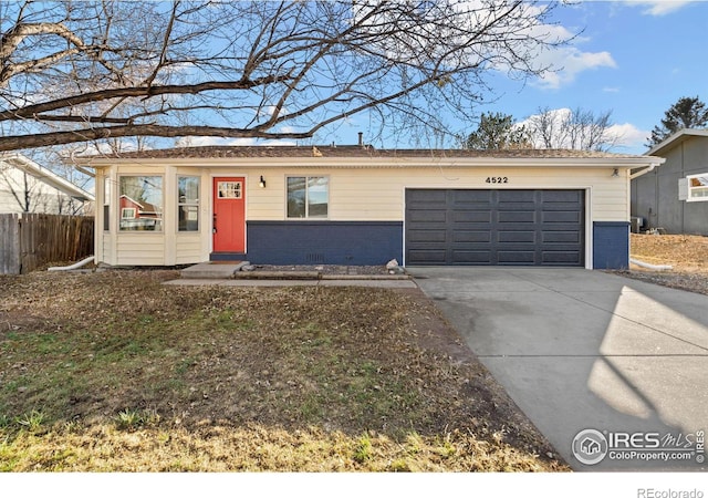 single story home featuring a garage