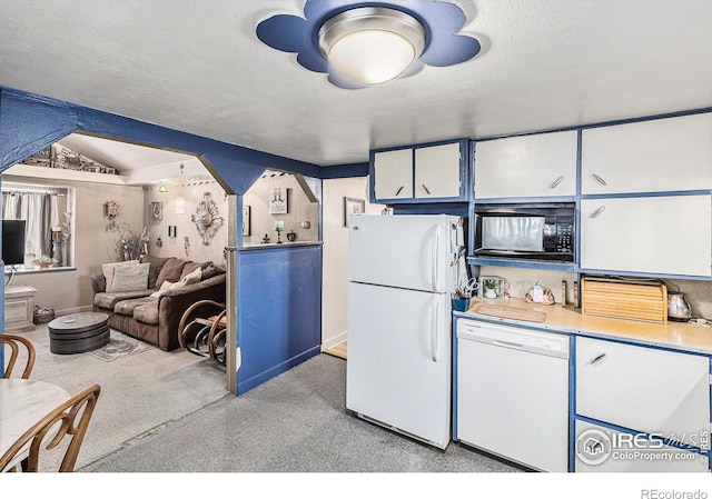 kitchen with white cabinetry, white appliances, a textured ceiling, and vaulted ceiling