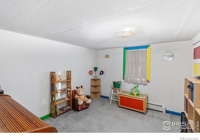 miscellaneous room with light carpet, a textured ceiling, and a baseboard heating unit