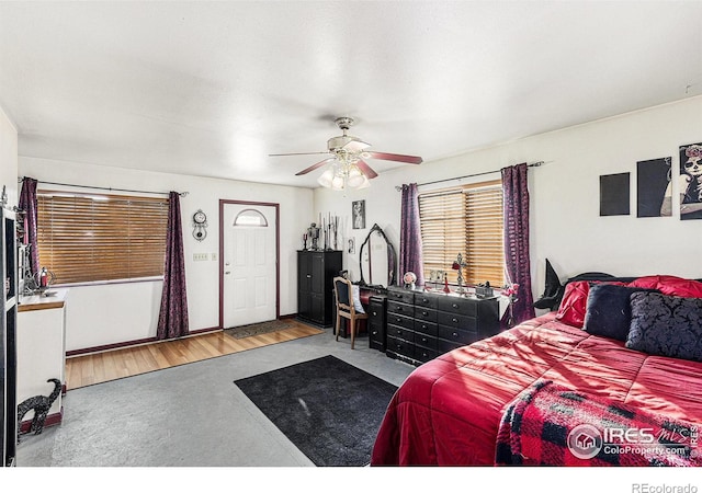 bedroom with wood-type flooring and ceiling fan