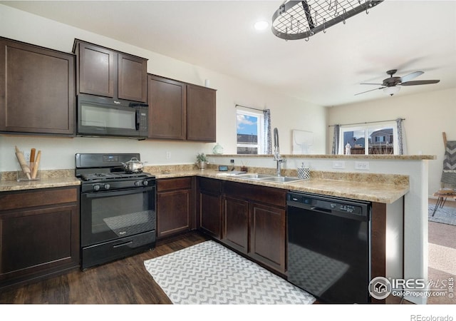 kitchen with black appliances, sink, dark hardwood / wood-style floors, ceiling fan, and dark brown cabinets