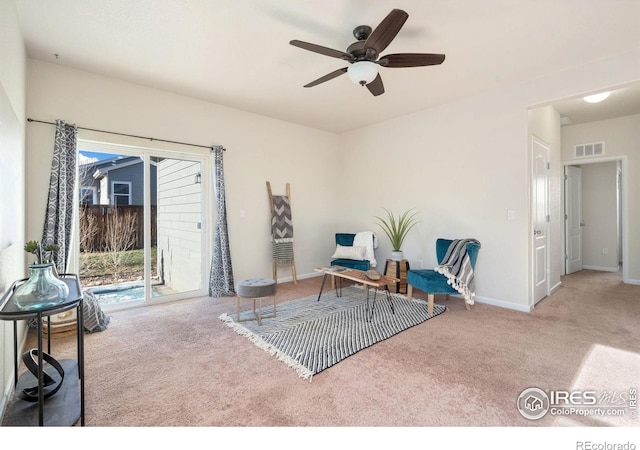 living area with ceiling fan and carpet floors