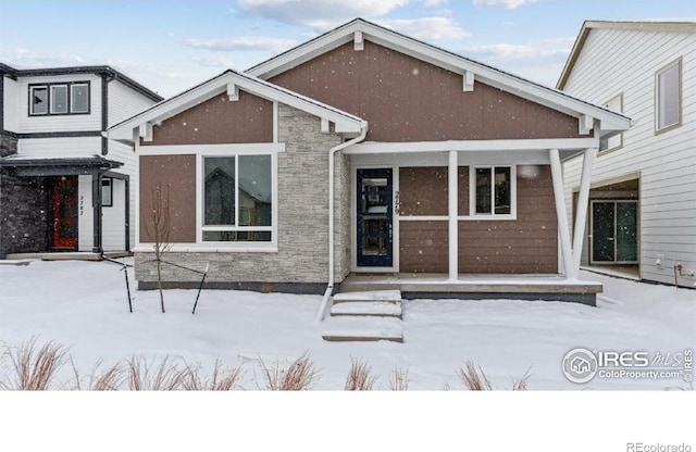 view of snow covered house