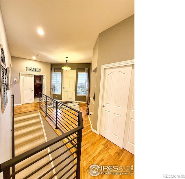 stairway with hardwood / wood-style flooring