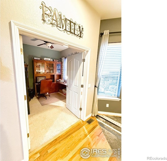 office featuring hardwood / wood-style flooring and ceiling fan