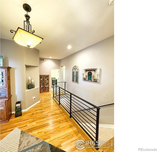 staircase featuring wood-type flooring