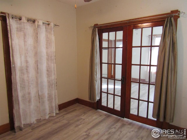 doorway featuring french doors and light wood-type flooring