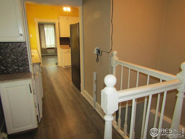 corridor featuring dark hardwood / wood-style flooring