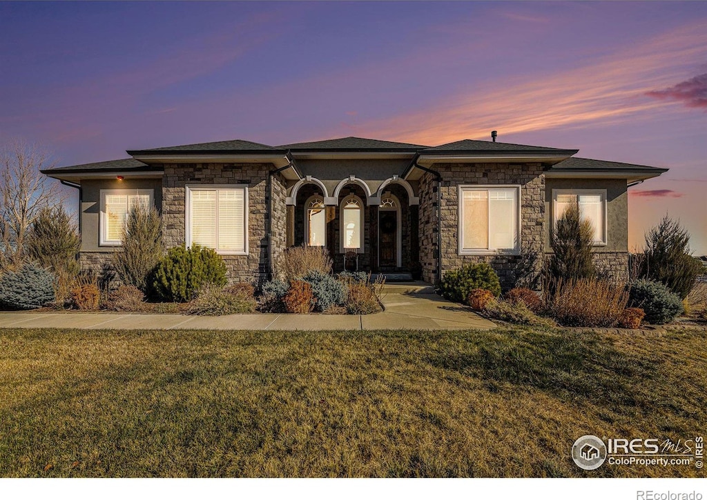 prairie-style house with a yard