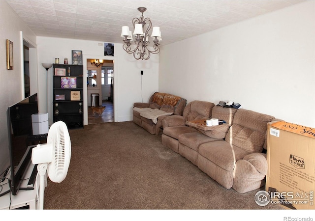 living room with carpet floors and a chandelier