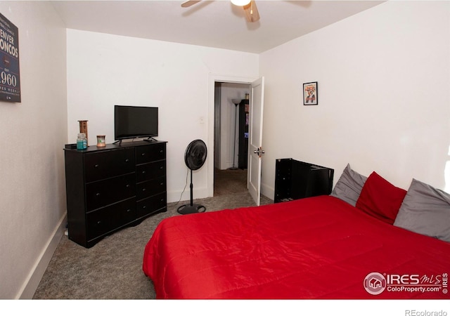 bedroom featuring ceiling fan and carpet