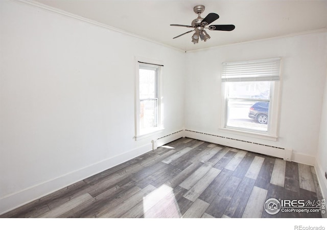 spare room with crown molding, ceiling fan, and hardwood / wood-style flooring