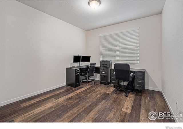 office space with dark wood-type flooring