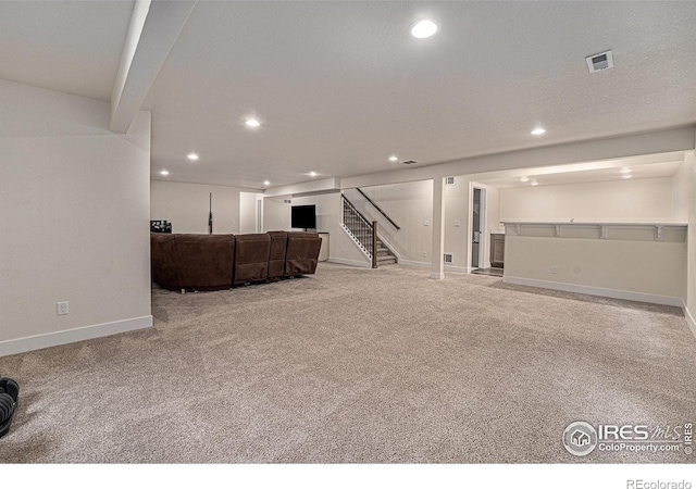 basement featuring light carpet