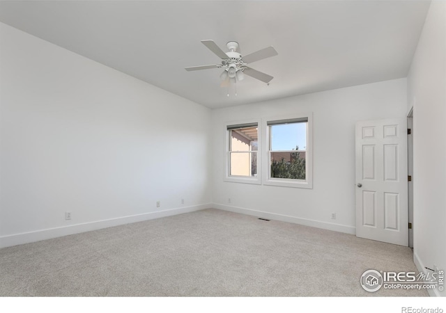 carpeted empty room with ceiling fan