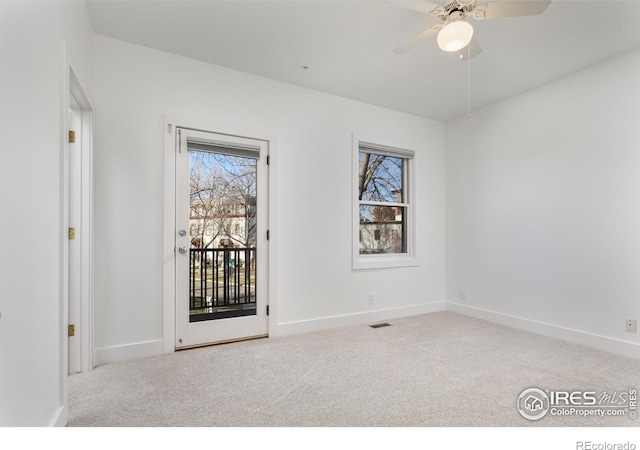 carpeted empty room with ceiling fan