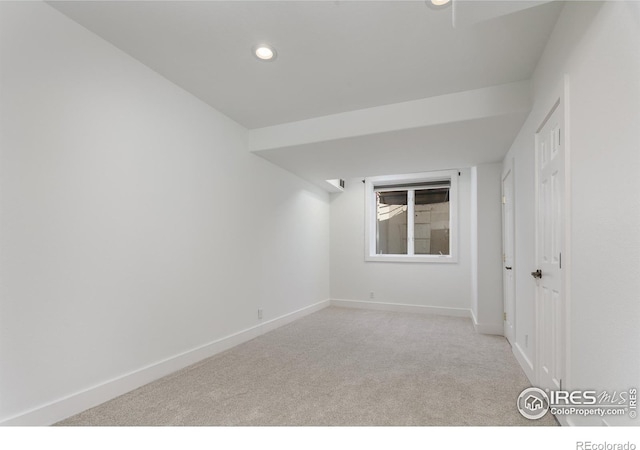 empty room with light colored carpet