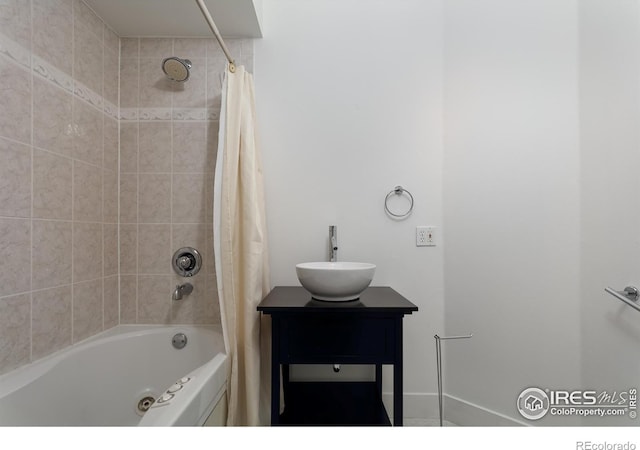 bathroom with sink and shower / bath combo with shower curtain