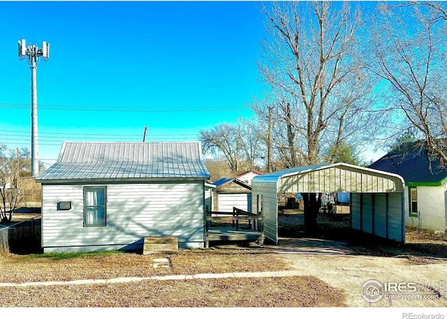 view of property exterior featuring a carport