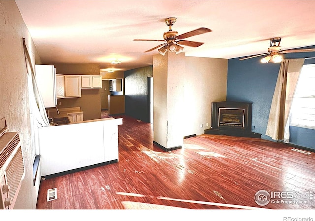 kitchen featuring white cabinets, dark hardwood / wood-style floors, and sink