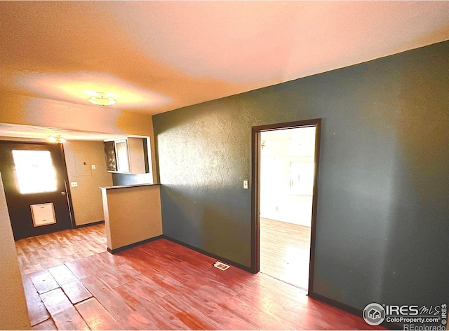 kitchen with hardwood / wood-style flooring