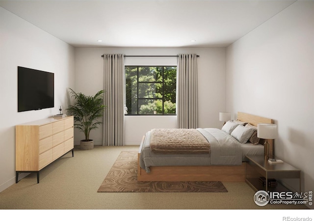 bedroom featuring light colored carpet