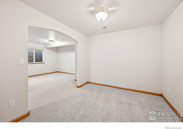 spare room with light colored carpet